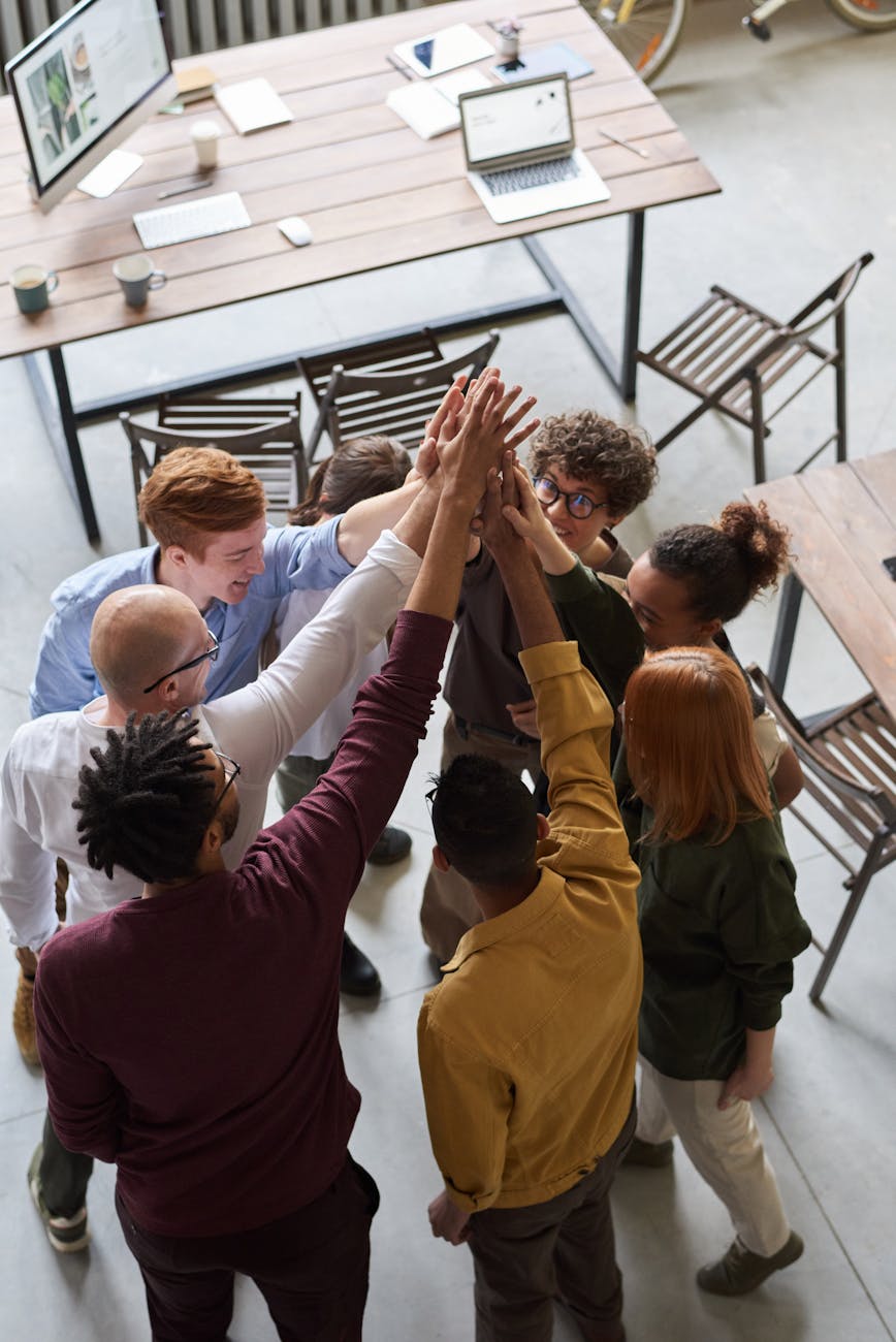 photo of people holding each other s hands